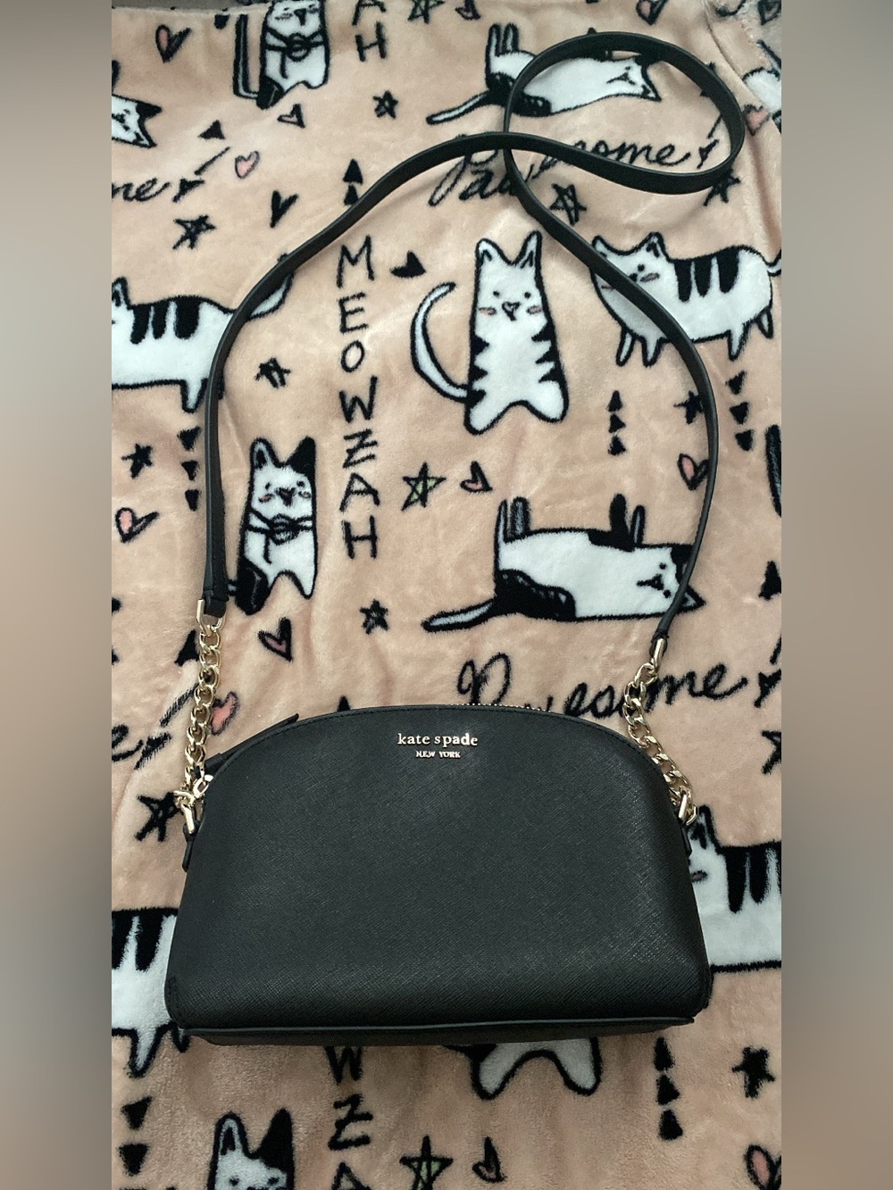 Kate Spade black crossbody with gold hardware.
